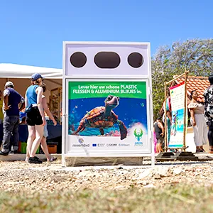 Green Phenix Recycling container at an event in Curacao